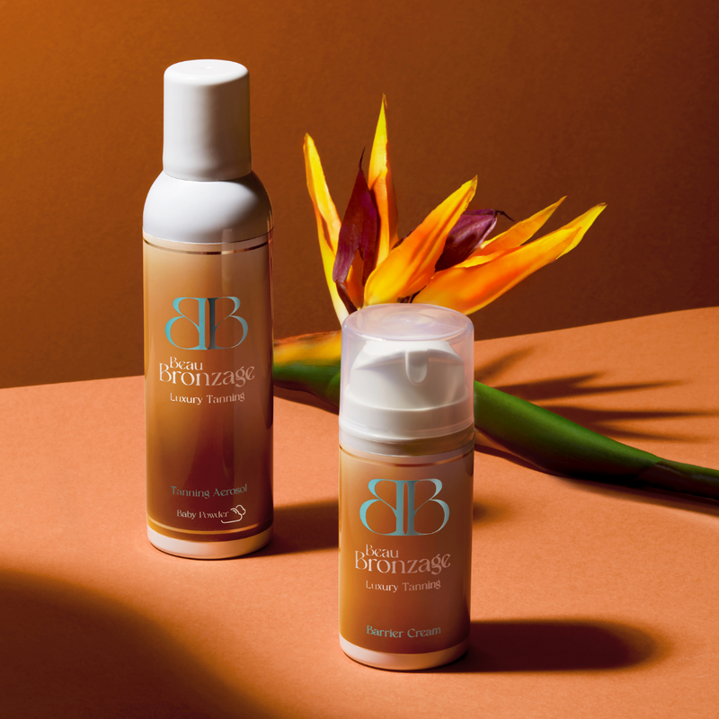 Beau Bronzage Pre-Tanning Barrier Cream and Tanning Mist, with bird of paradise flower in the background